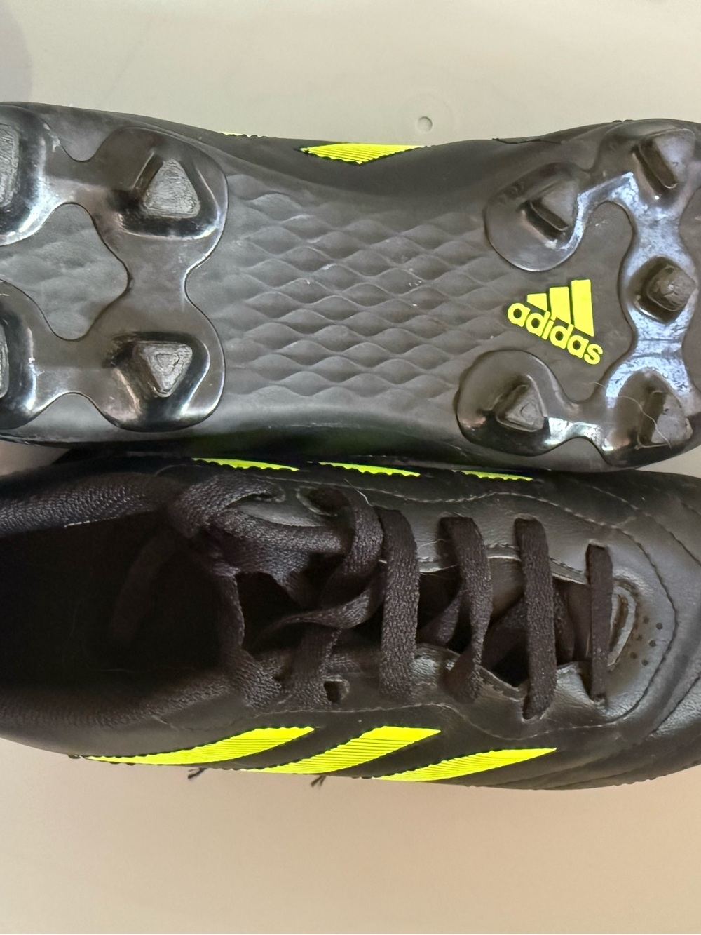 Black Athletic Cleats with Neon Yellow Stripes - Picture 2 of 2